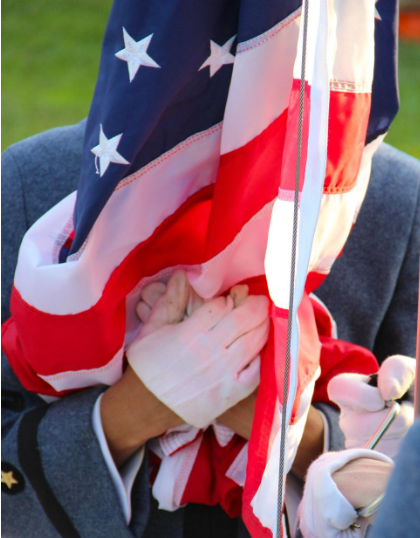 Soldier holding an American Flag